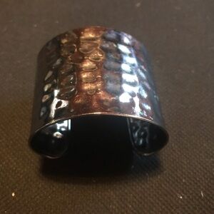Large silver cuff bracelet.